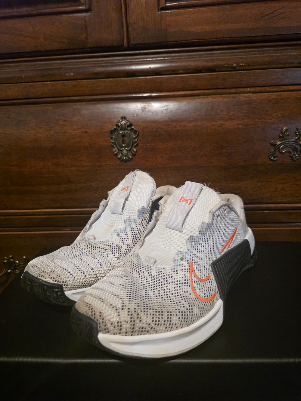 Nike Women's Light Gray Knit Athletic Shoes with Orange Swoosh